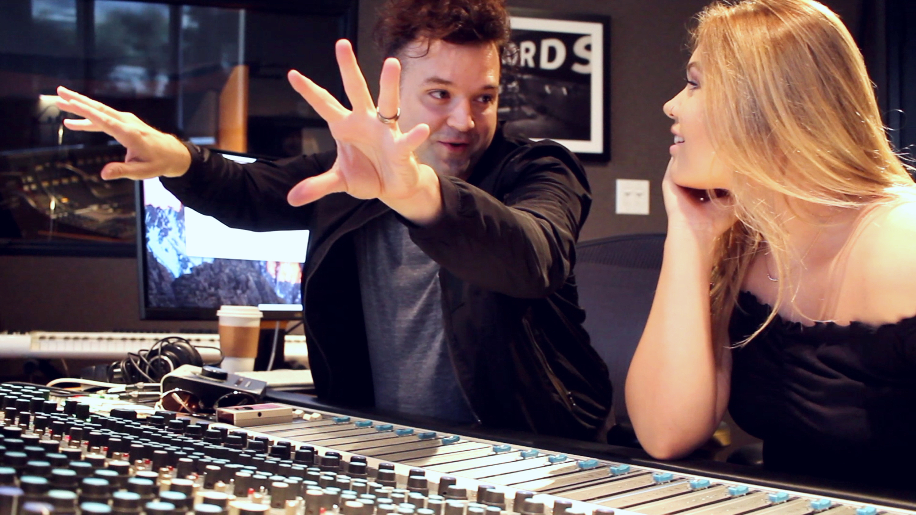 Nathan Walters working with an artist in the studio